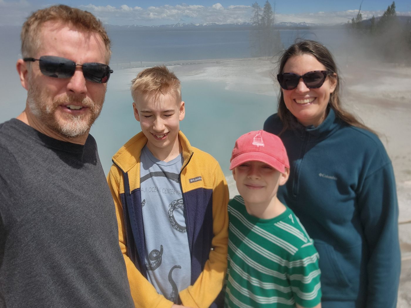 All four Fosters in front of the turquoise Black Pool at West Thumb
