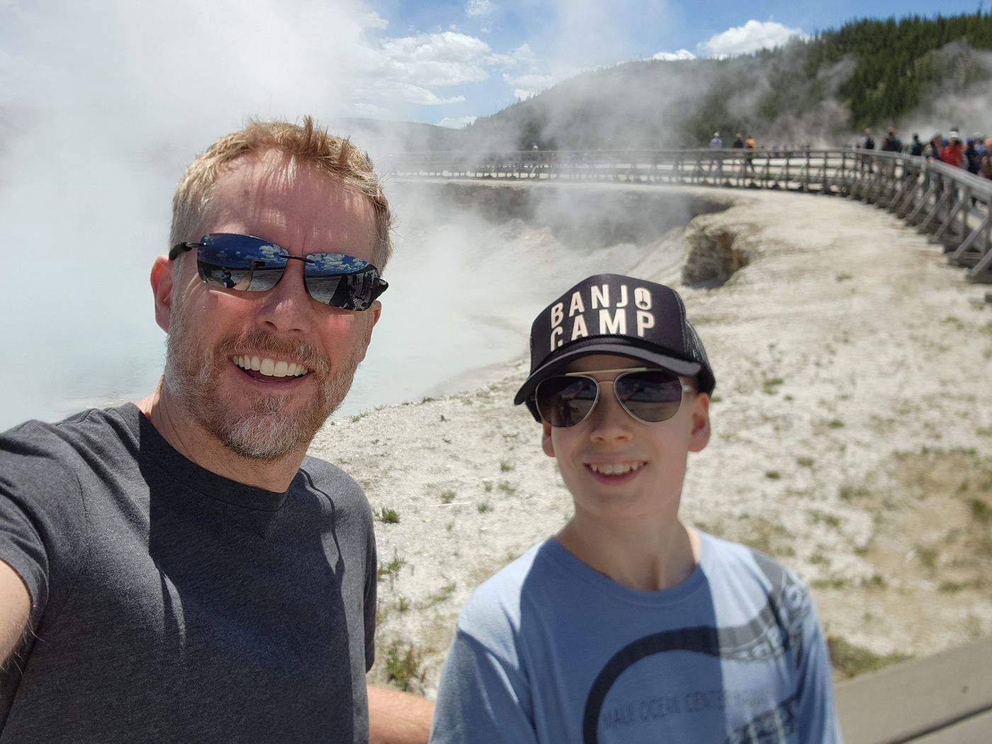 Selfie on the Grand Prismatic boardwalk, steam rising behind