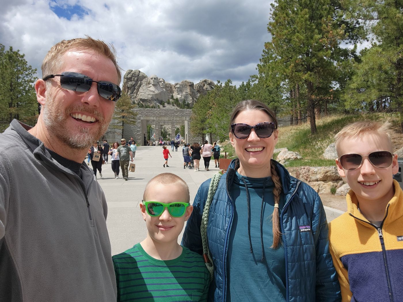Family selfie in front of Mount Rushmore